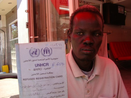 South Sudanese asylum seeker with his UNHCR papers (photo: Mya Guarnieri)